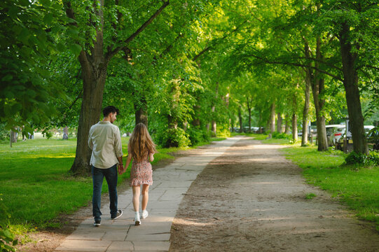Couple Walking Through Cambridge Park