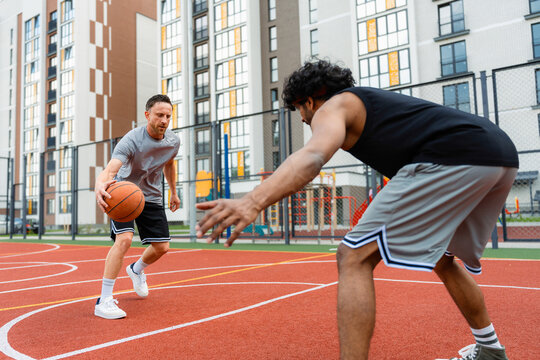 Men play basketball