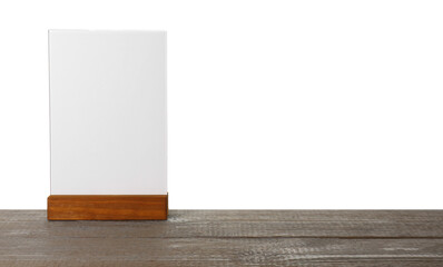 Menu holder on wooden table against white background. Mockup for design