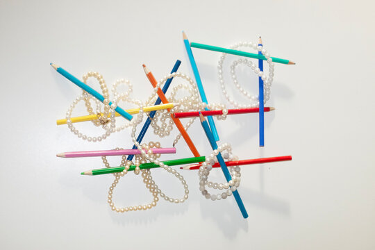 Jewelry accessories pearls and pencils with hard direct flashlight