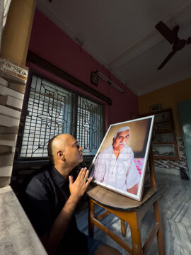 Indian man offering respect to his deceased father