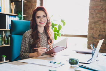Photo of attractive good mood lady ceo dressed formal shirt write copybook talking headphones mic...