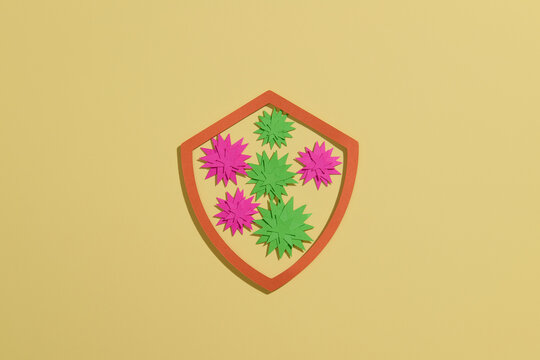 Colorful Paper viruses on Shield Shape with Yellow Background