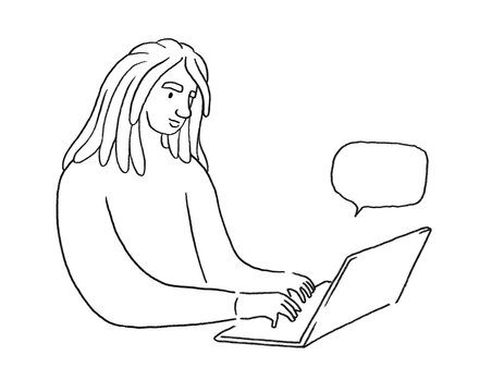 Young person with dreadlocks working on a computer