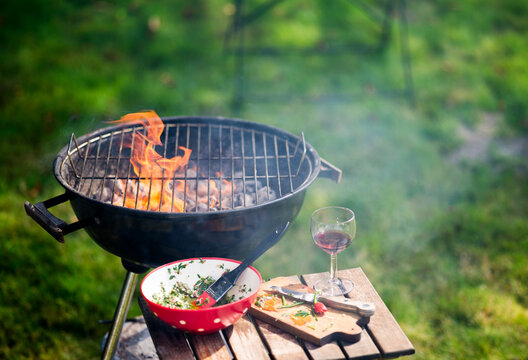 Backyard Grill With Flames and Wine