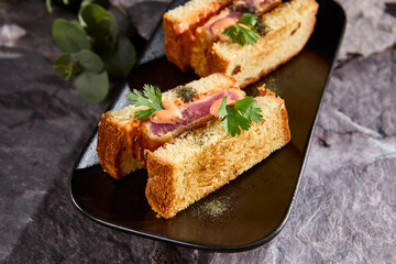Japanese Sando Sandwich with Tuna on a Dark Slate Background