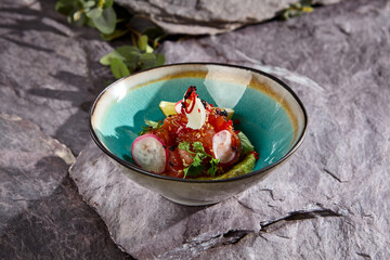 Fresh Tuna Tartare with Cilantro, Avocado, and Lime on Stone Background