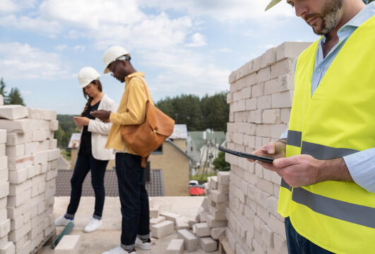 Architect Using Tablet On Construction Site 