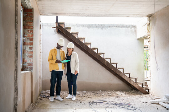 Architects Looking At Construction Plans