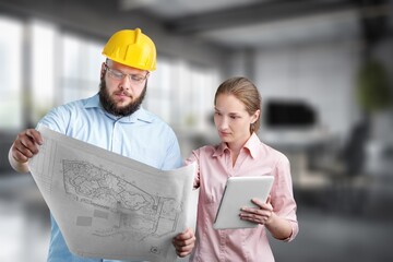 Portrait of professional engineer reading project