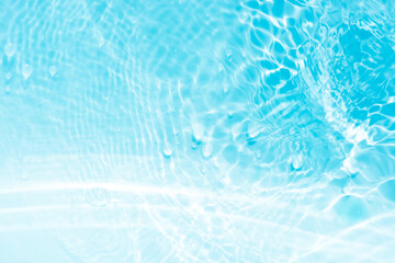 Blue water with ripples on the surface. Defocus blurred transparent blue colored clear calm water...