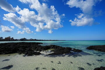 clear shoaling beach and charming clouds