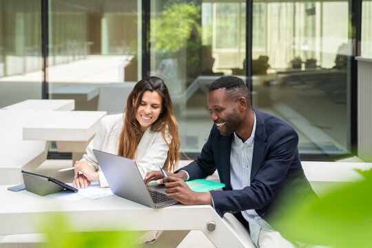 Office Colleagues Working At The Table 