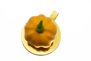 Cake shaped in the form of a pumpkin.  Delicious halloween cookie