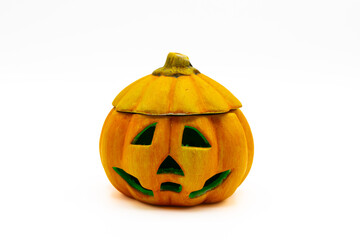 Jack O Lantern isolated on white background. Ceramic candle holder in the shape of a halloween pumpkin.