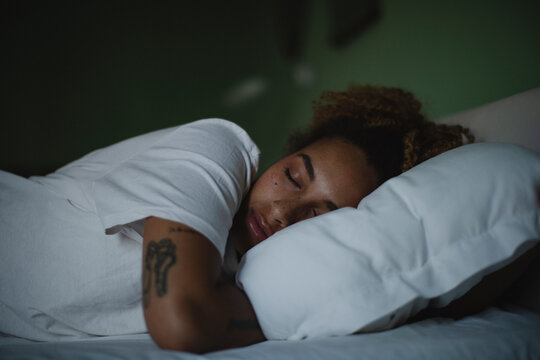 Woman Sleeping on White Pillow
