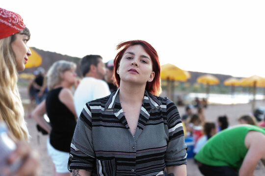 Friends stood on the shoreline
