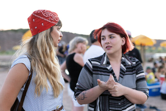 Friends stood on the shoreline