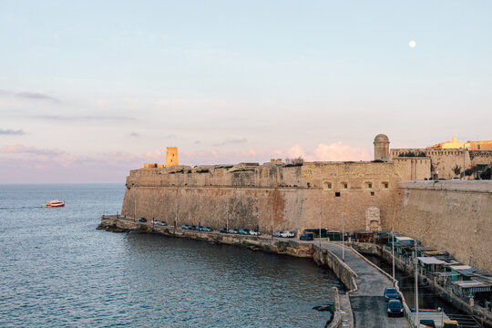 Sea and the Fortress Wall of Valleta City on Malta at Sunset