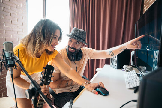 Musicians enjoying time together playing music at studio home