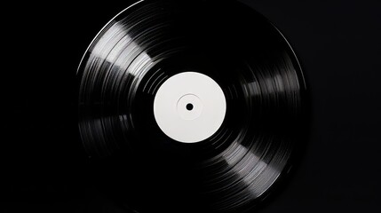 A vinyl record with no markings, placed against a solid black background. The background is isolated, making the record the focal point with plenty of copy spaced