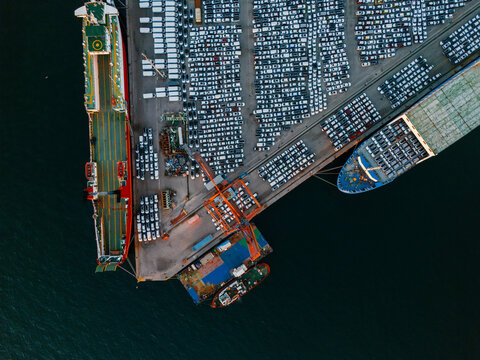 Drone aerial Perspective of Port with Cargo Ships and Vehicles