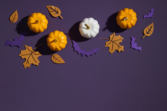 Halloween Decorations With Pumpkins, Leaves, And Bats