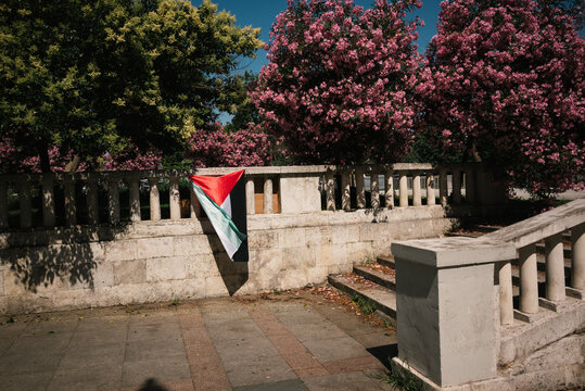 Palestinian Flag Hanging on Stone Railing