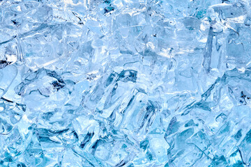 Top view of crystal clear ice cubes as background