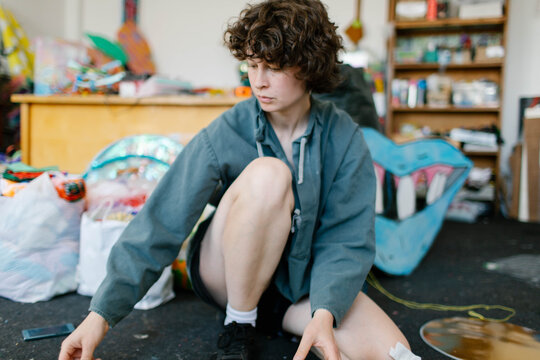 a young woman makes decorations in the workshop