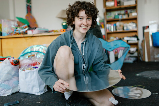 a young woman makes decorations in the workshop