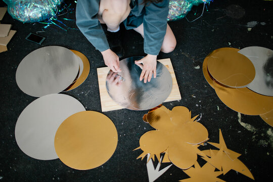 a young woman makes decorations in the workshop