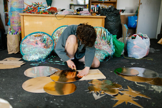 a young woman makes decorations in the workshop