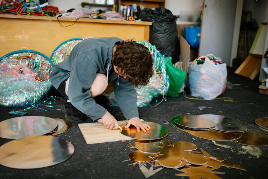 a young woman makes decorations in the workshop