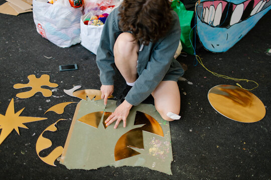 a young woman makes decorations in the workshop