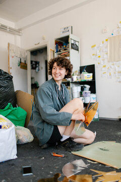 a young woman makes decorations in the workshop