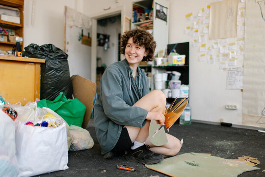 a young woman makes decorations in the workshop