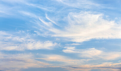 Late afternoon, faint white clouds in the blue sky.
