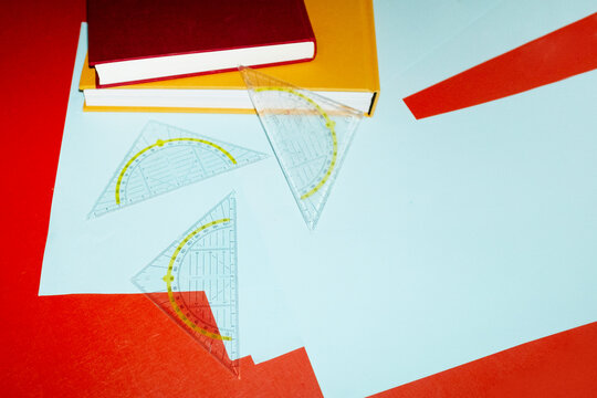 Set square rulers on business office desk and hard direct flashlight