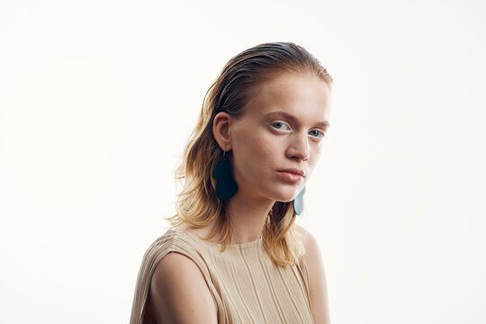 Portrait of a woman in a beige blouse