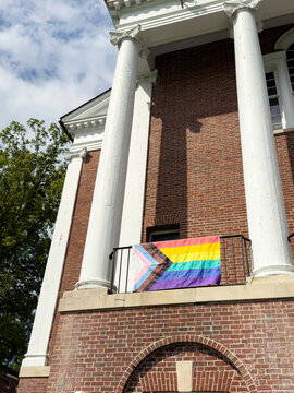  Gay Pride Flag on brick Building 