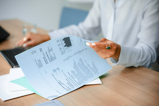 A woman studies documents