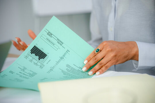 A woman studies documents