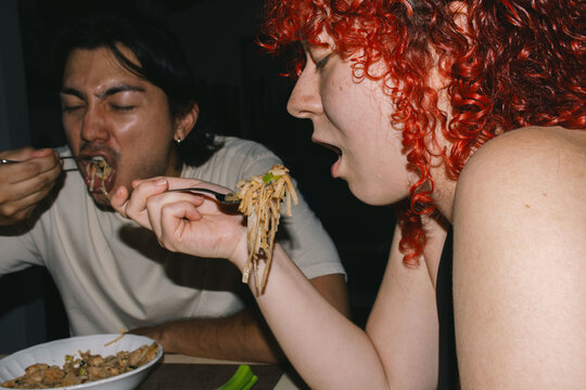 wo people eating pad thai