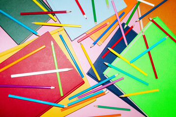 Colorful drawing creative pencils and books and hard direct flashlight