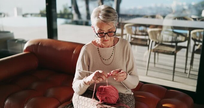 Relax, knitting and senior woman in home with creative hobby, calm morning and break on retirement holiday. Wool, yarn and old person in living room with peace, wellness and handmade craft on weekend