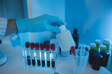 working atmosphere in the laboratory, chemistry and science specialist working in a lab with...