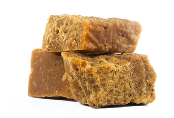 pieces of artisanal sugar cane panela on an isolated white background
