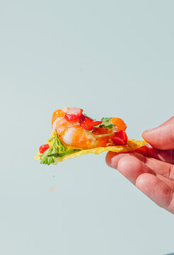 Hand holding a super fresh Prawn ceviche