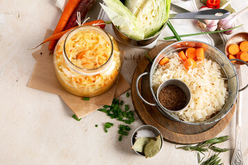 Winter salad of marinated cabbage and carrot Homemade sauerkraut in a jar on wooden background